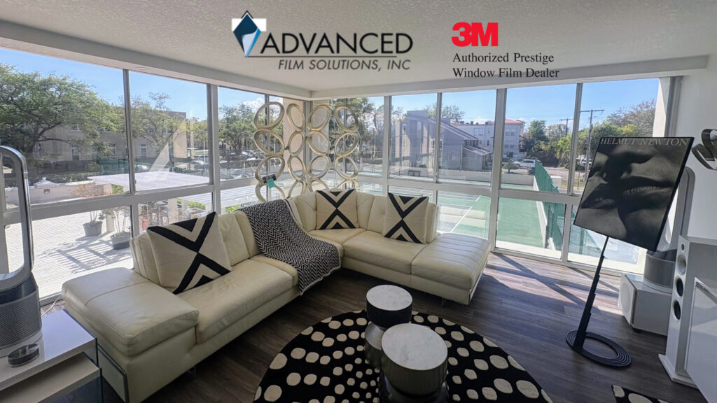 Residential window film installation in a Lakeland Florida living room to block solar heat.